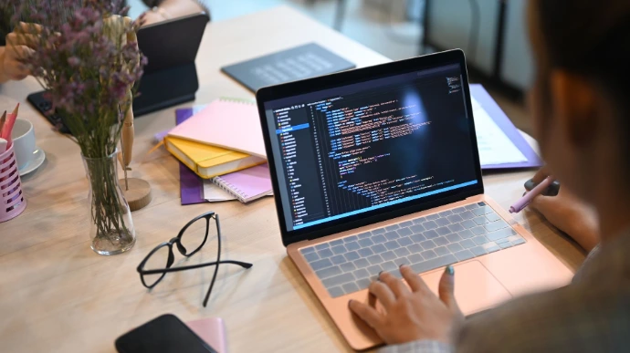 Man working on computer with glasses
