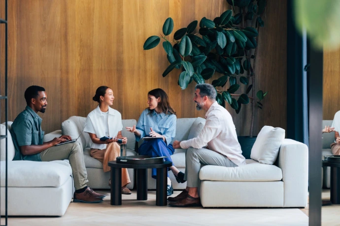 Team discussion with plant